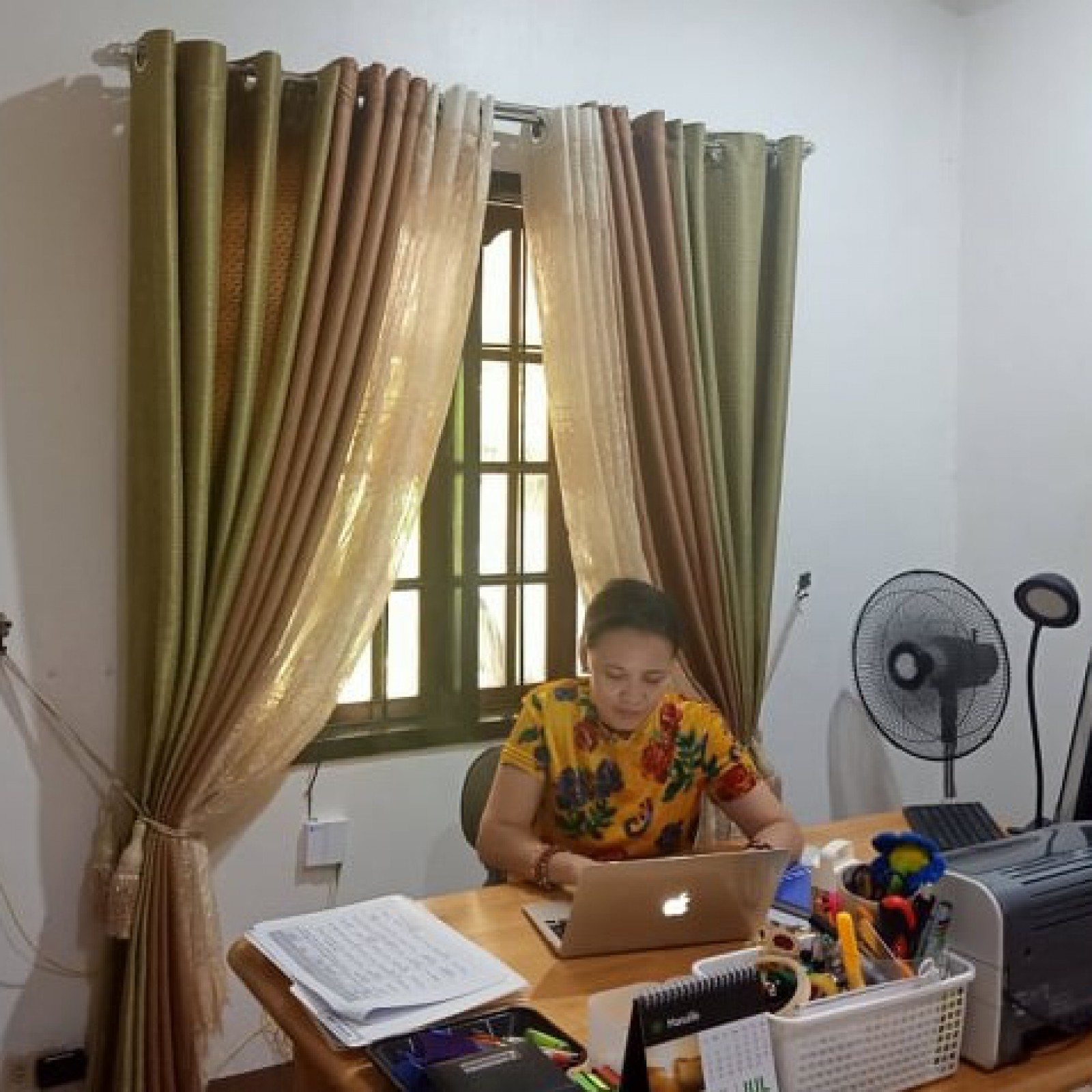 Mme. Lea Amores (GS Principal) doing admin work from home